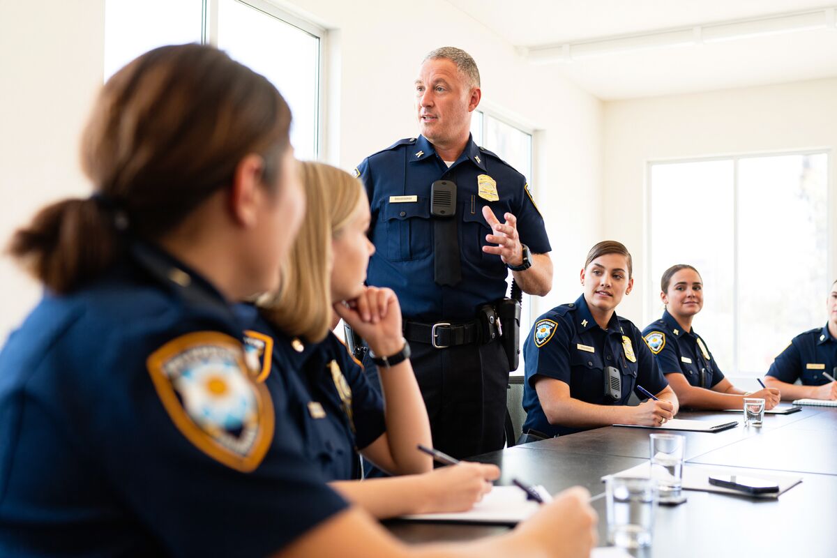 A police sergeant addressing officers during a briefing